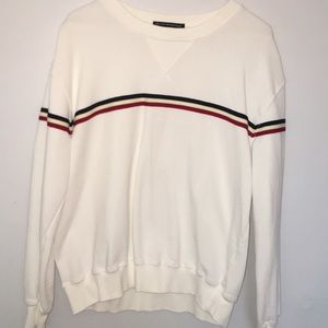 White sweatshirt with red, white, and blue stripes